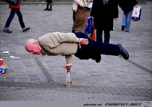 man-balancing-bottle