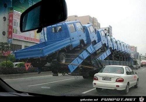 trucks-balanced-over-road