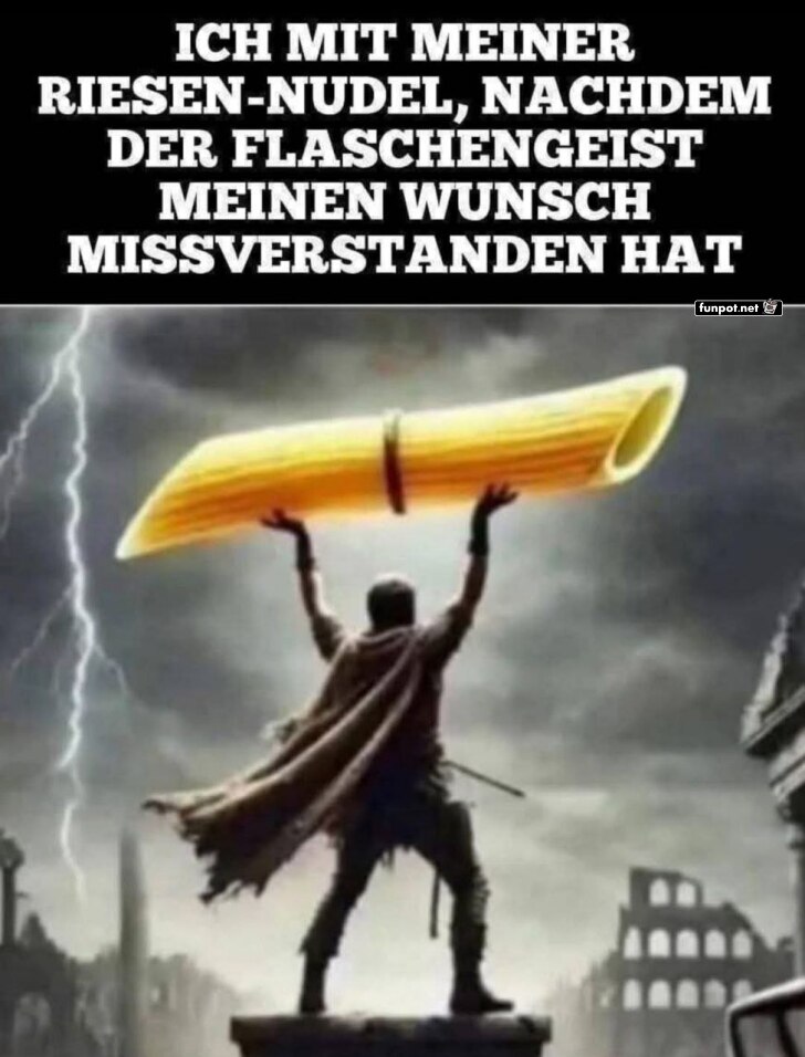 Mann mit riesiger Nudel hebt sie triumphierend Mann mit riesiger Nudel hebt sie triumphierend