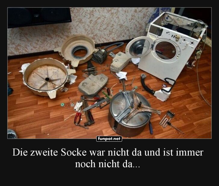 Zerlegte Waschmaschine auf der Suche nach Socken Zerlegte Waschmaschine auf der Suche nach Socken