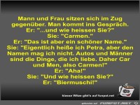 Mann und Frau sitzen sich im Zug gegen�ber