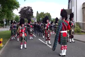 Massed Pipes & Drums parade through Deeside town to start th